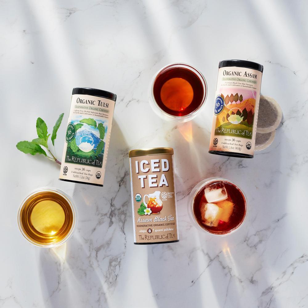 Assortment of Republic of Tea organic teas including Organic Tulsi, Organic Assam, and iced Assam black tea with brewed tea in glasses