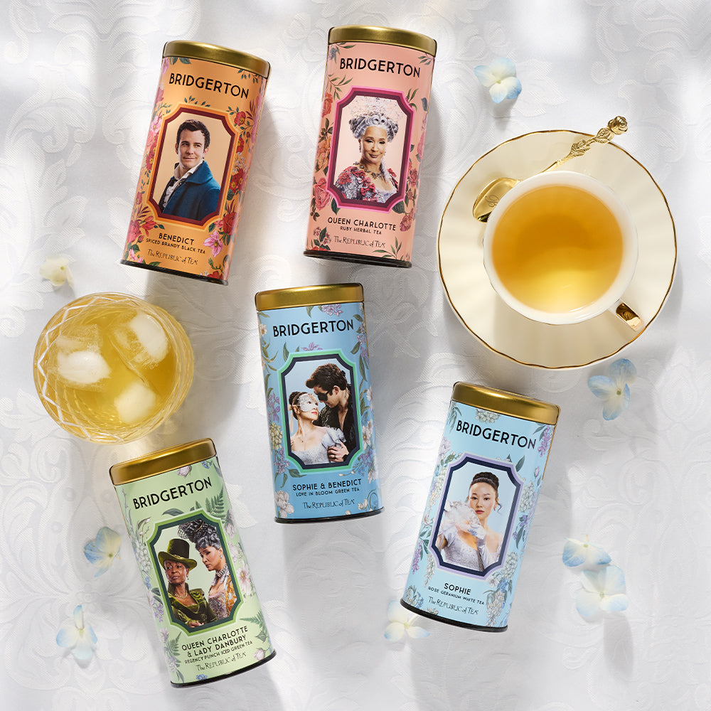 Bridgerton themed tea tins from The Republic of Tea with hot tea and iced tea on a decorative table